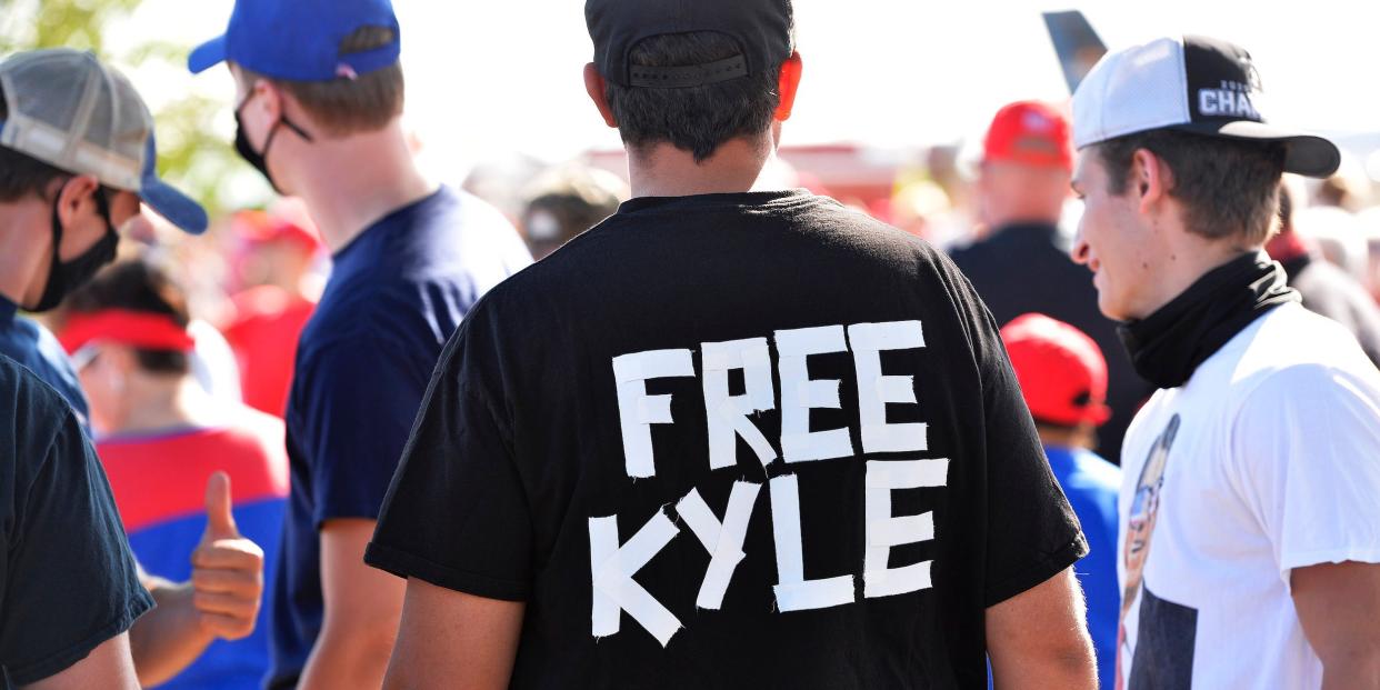 A man wears a shirt calling for freedom for Kyle Rittenhouse, 17, the man who allegedly shot protesters in Wisconsin, during a US President Donald Trump Campaign Rally, the day after the end of the Republican National Convention, at Manchester airport in Londonderry, New Hampshire, on August 28.