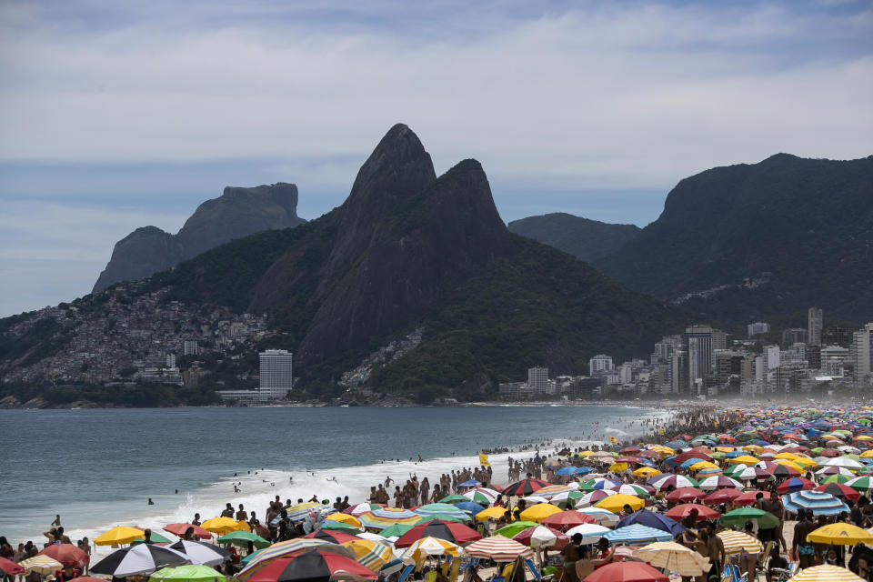 Despite restrictions to limit the spread of COVID-19, thousands crowd Ipanema Beach in Rio de Janeiro, Brazil, Sunday, Jan. 24, 2021. (AP Photo/Bruna Prado)