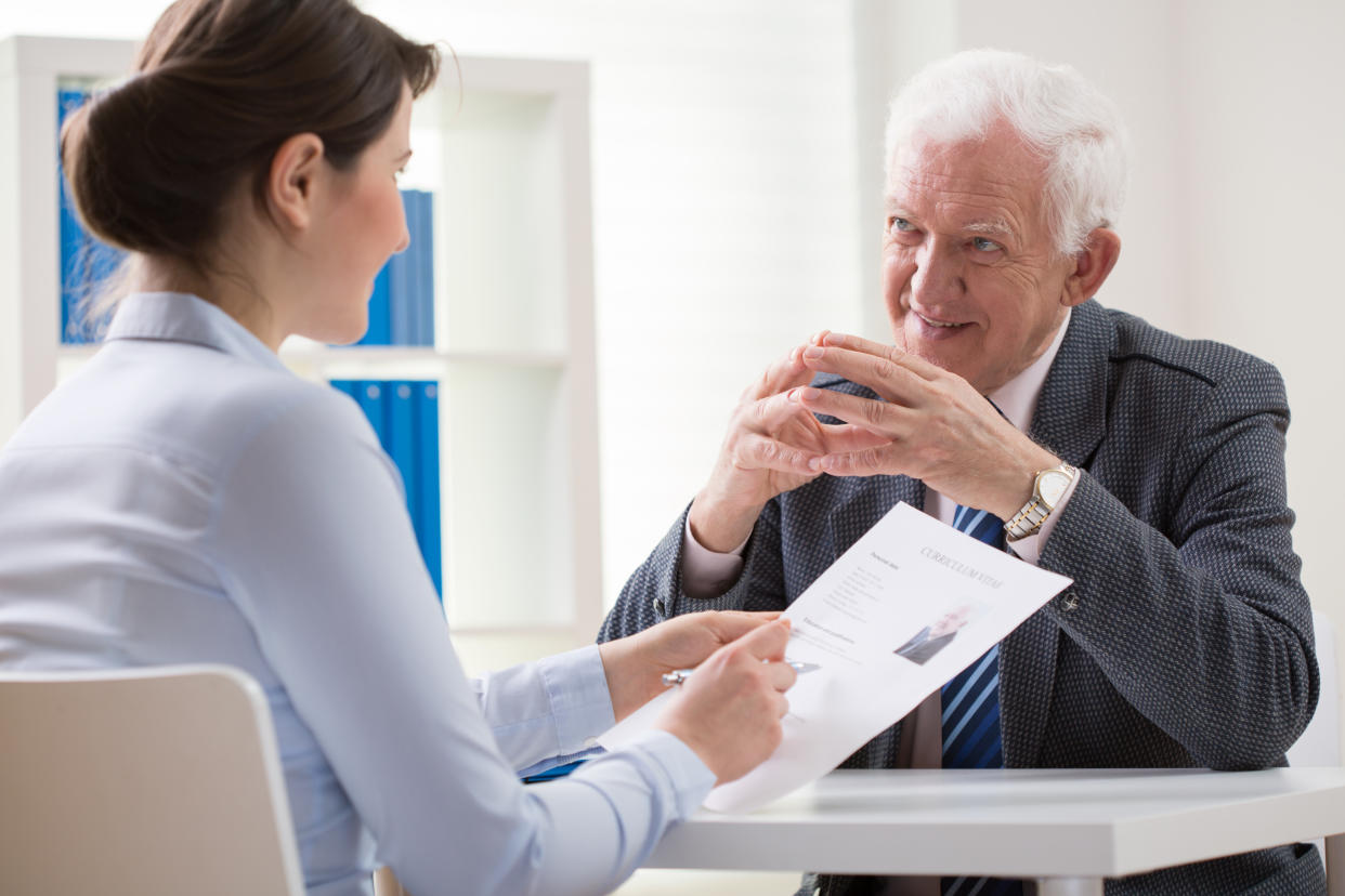 Elder man answering the questions on job interview