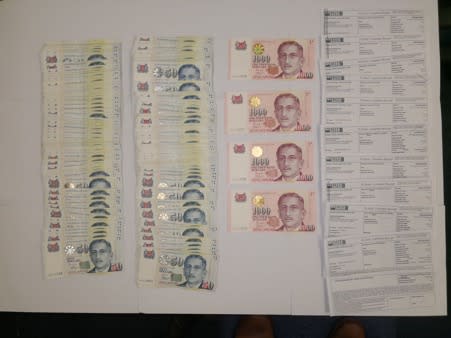 Money seized during a joint investigation of an Internet love scam syndicate operating in Singapore and Malaysia. (Photo: Singapore Police Force)