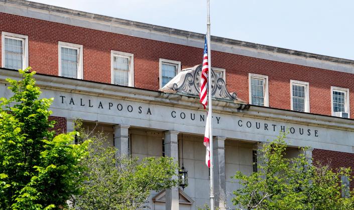 Flags fly at half staff at the Tallapoosa County Courthouse in Dadeville, Ala., on Tuesday April 25, 2023, during hearings for the suspents in the Dadeville shooting.