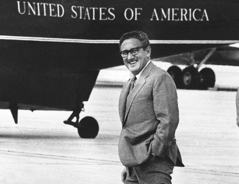 Henry Kissinger smiles as he walks to a helicopter at Andrews Air Force Base near Washington, Saturday, Aug. 19, 1972 (AP)