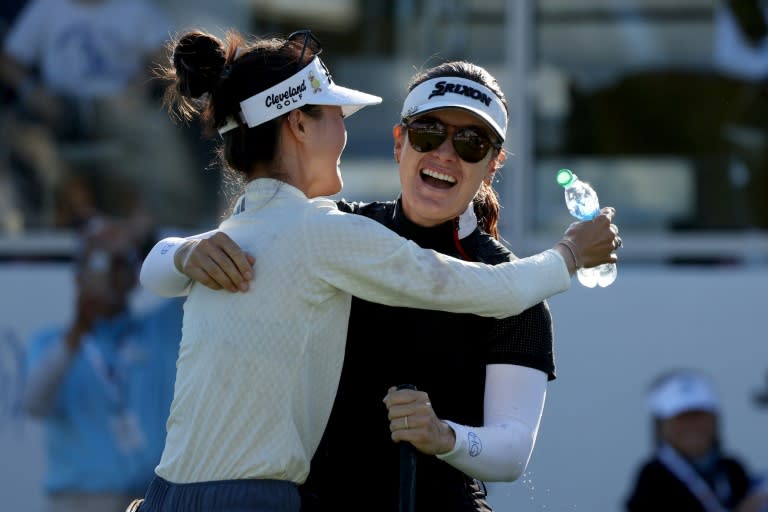 Hannah Green celebrates with fellow Australian Grace Kim after winning the LPGA's LA Championship at Wilshire Country Club on Sunday. (Harry How)