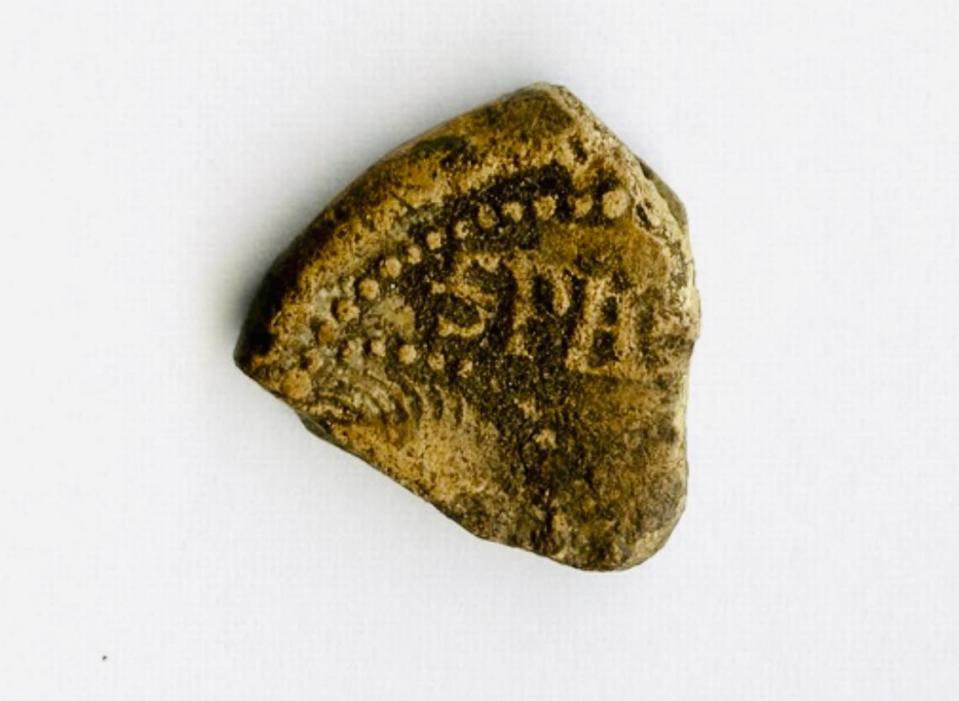 The other side of the 650-year-old papal bulla, or lead seal, found by Jacek Ukowski.