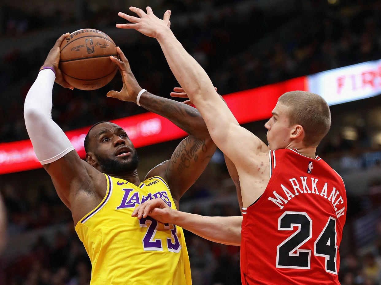 CHICAGO, ILLINOIS - MARCH 12: LeBron James #23 of the Los Angeles Lakers shoots against Lauri Markkanen #24 of the Chicago Bulls at the United Center on March 12, 2019 in Chicago, Illinois. NOTE TO USER: User expressly acknowledges and agrees that, by downloading and or using this photograph, User is consenting to the terms and conditions of the Getty Images License Agreement. (Photo by Jonathan Daniel/Getty Images)