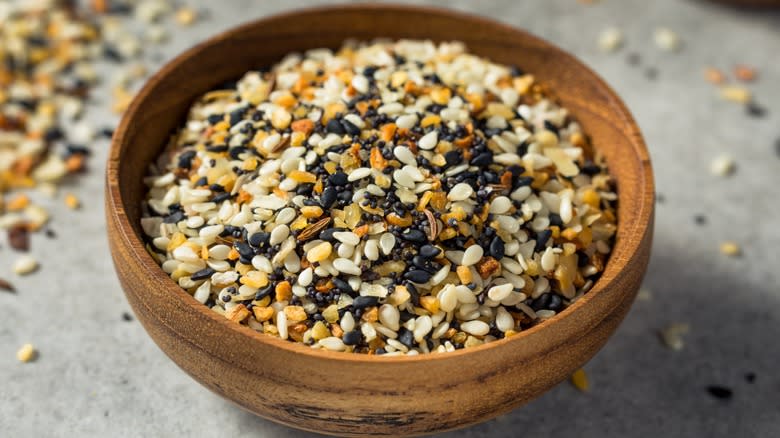 Close-up of everything bagel seasoning in a wooden bowl