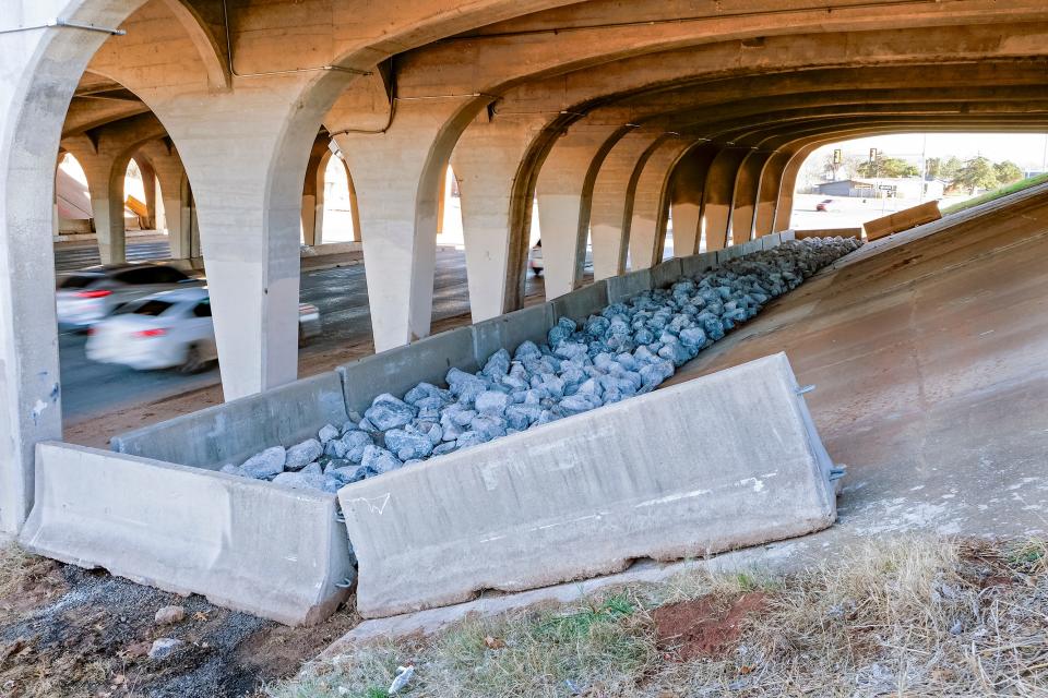 Concrete Jersey barriers and big rocks have been placed at a recently cleared encampment site under the Interstate 44 bridge over N Pennsylvania Avenue in an attempt to secure them from being resettled.