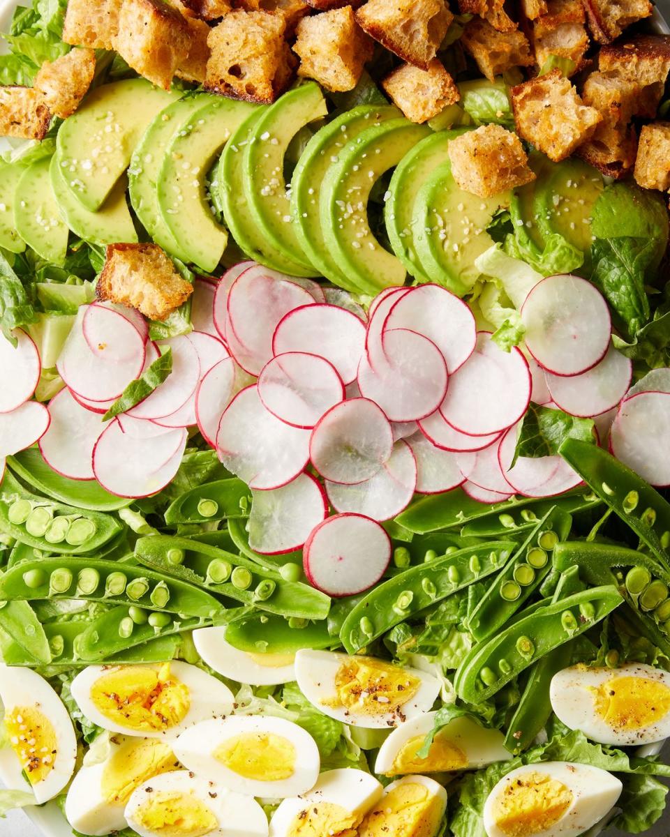 <p>Everyone’s favorite <a href="https://www.delish.com/cooking/recipe-ideas/recipes/a58703/best-cobb-salad-recipe/" rel="nofollow noopener" target="_blank" data-ylk="slk:Cobb salad;elm:context_link;itc:0;sec:content-canvas" class="link ">Cobb salad</a> just got a spring-y makeover. This lightened-up version has lots of crunchy in-season veggies, <a href="https://www.delish.com/cooking/recipe-ideas/a33462622/homemade-croutons-recipe/" rel="nofollow noopener" target="_blank" data-ylk="slk:homemade croutons;elm:context_link;itc:0;sec:content-canvas" class="link ">homemade croutons</a>, <a href="https://www.delish.com/cooking/recipe-ideas/recipes/a58284/how-to-make-perfect-hard-boiled-eggs/" rel="nofollow noopener" target="_blank" data-ylk="slk:hard-boiled eggs;elm:context_link;itc:0;sec:content-canvas" class="link ">hard-boiled eggs</a> for protein, and a creamy lemon-dill dressing spiked with raw garlic. Yum!</p><p>Get the <strong><a href="https://www.delish.com/cooking/recipe-ideas/a39831300/spring-cobb-salad-recipe/" rel="nofollow noopener" target="_blank" data-ylk="slk:Spring Cobb Salad recipe;elm:context_link;itc:0;sec:content-canvas" class="link ">Spring Cobb Salad recipe</a></strong>.</p>