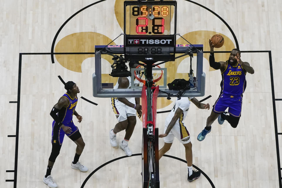 Los Angeles Lakers forward LeBron James (23) goes to the basket in the first half of an NBA basketball game in New Orleans, Sunday, Dec. 31, 2023. The Pelicans won 129-109. (AP Photo/Gerald Herbert)
