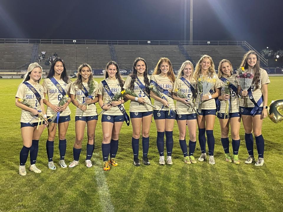 Senior from the Gulf Breeze girls soccer team poses for photos during Senior Night festivities prior to the Dolphins' match against South Walton on Wednesday, Jan. 11, 2023 from Dolphin Stadium.