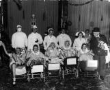 <p>The <a href="http://www.thecanadianencyclopedia.ca/en/article/dionne-quintuplets/" rel="nofollow noopener" target="_blank" data-ylk="slk:Dionne quintuplets;elm:context_link;itc:0;sec:content-canvas" class="link ">Dionne quintuplets</a>— the first set to survive more than a week—were born in May 1934 in Ontario, Canada, and instantly became a worldwide sensation. Fearing their impoverished parents wouldn't be able to protect them from exploitation, the government placed the baby girls in a special hospital; their mother, Oliva, fought for nine years to regain custody. Here, actress Lucille Ball (front and center) and a group of friends dressed as the quintuplets for a 1935 Halloween party. </p>