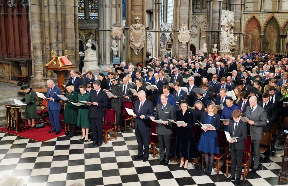 Britain's Queen Elizabeth II (L), and front row (L to R) Britain's Prince Charles, Prince of Wales, Britain's Camilla, Duchess of Cornwall, Britain's Princess Anne, Princess Royal, and Vice Admiral Timothy Laurence, Britain's Prince Andrew, Duke of York, Britain's Prince Edward, Earl of Wessex, Britain's Sophie, Countess of Wessex, Britain's Lady Louise Windsor and Viscount James Mountbatten-Windsor, and second row (L to R) Britain's Prince William, Duke of Cambridge, Britain's Prince George of Cambridge, Britain's Catherine, Duchess of Cambridge, Peter Phillips, and his daughters Savannah and Isla, Mia Grace Tindal and her parents Zara Phillips amd Mike Tindall, attend a Service of Thanksgiving for Britain's Prince Philip, Duke of Edinburgh, at Westminster Abbey in central London on March 29, 2022. - A thanksgiving service will take place on Tuesday for Queen Elizabeth II's late husband, Prince Philip, nearly a year after his death and funeral held under coronavirus restrictions. Philip, who was married to the queen for 73 years, died on April 9 last year aged 99, following a month-long stay in hospital with a heart complaint. (Photo by Dominic Lipinski / POOL / AFP) (Photo by DOMINIC LIPINSKI/POOL/AFP via Getty Images)