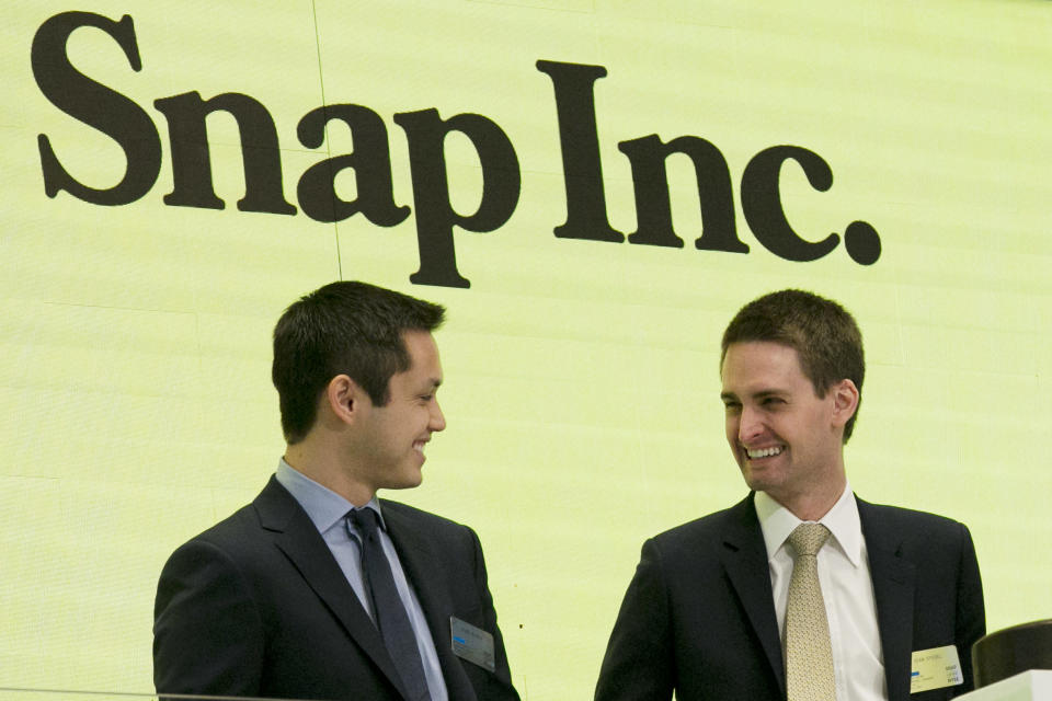 Snap co-founders Bobby Murphy, left, and CEO Evan Spiegel ring the opening bell at the New York Stock Exchange as the company celebrates its IPO. (AP Photo/Richard Drew, File)