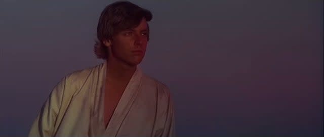 Luke staring at the twin suns on Tatooine in "Star Wars: Episode IV - A New Hope"