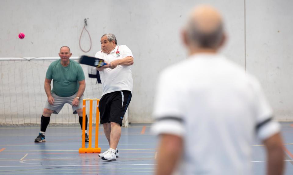 <span>Walking cricket being played by a group of over-50s men at Three Hills Sport Centre in Folkestone.</span><span>Photograph: Andrew Aitchison/The Guardian</span>