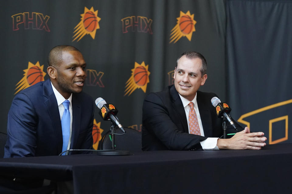 James Jones, left, president of basketball operations and general manager for the Phoenix Suns, speaks about the Suns new head coach Frank Vogel, right, during a news conference Tuesday, June 6, 2023, in Phoenix. (AP Photo/Ross D. Franklin)