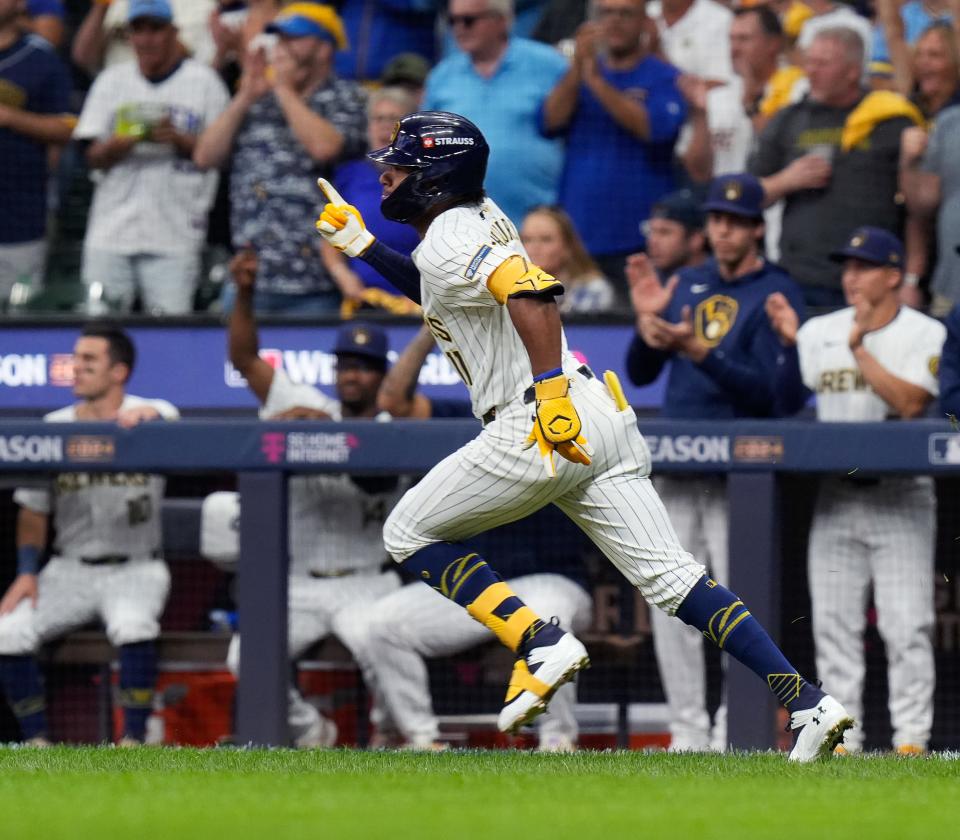 Milwaukee Brewers left fielder Jackson Chourio (11) singles on a sharp ground ball to New York Mets center fielder Tyrone Taylor (15) during the first inning of Game 3 of National League wild-card series on Thursday October 3, 2024 at American Family Field in Milwaukee, Wis.