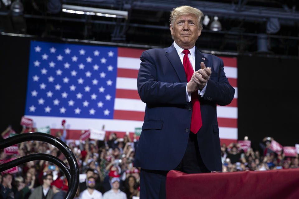 President Donald Trump arrives for a campaign rally at Kellogg Arena, Wednesday, Dec. 18, 2019, in Battle Creek, Mich. (AP Photo/ Evan Vucci)