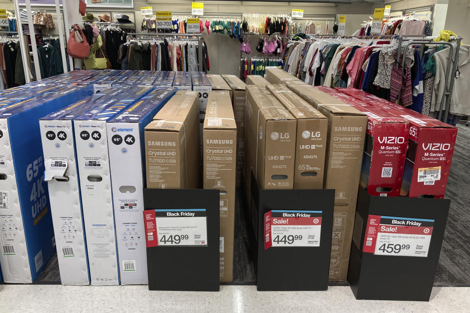 Big screen televisions are lined up in preparation for Black Friday sales at the Target Corp., store, Monday, Nov. 21, 2022, in Southfield, Mich. Shoppers with wallets stretched by high inflation still will find deals on Black Friday and this holiday season thanks to retailers trying to unload hefty stocks of unsold goods. (AP Photo/Carlos Osorio)