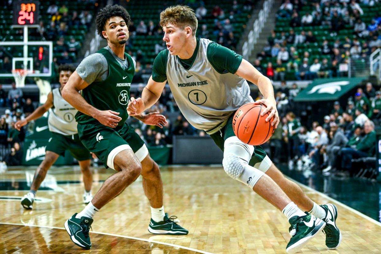 Michigan State's Gehrig Normand, right, moves the ball as Malik Hall defends during an MSU basketball team scrimmage on Saturday, Oct. 21, 2023, at the Breslin Center in East Lansing.