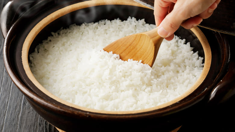 Scooping freshly cooked rice