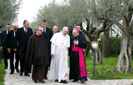 Pope Francis is welcomed by Archbishop of Benevento Felice Accrocca as he arrives in Pietrelcina, Italy March 17 2018. REUTERS/Ciro De Luca