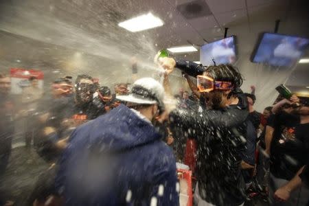 Oct 6, 2015; Bronx, NY, USA; Houston Astros center fielder Jake Marisnick (right) celebrates with teammates in the locker room after defeating the New York Yankees in the American League Wild Card playoff baseball game at Yankee Stadium. Houston won 3-0. Mandatory Credit: Adam Hunger-USA TODAY Sports