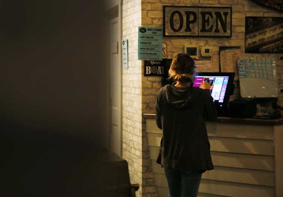 Marine City Fish Company staff member Kiersten Garrow at Marine City Fish Company on Thursday, Jan. 13, 2022.