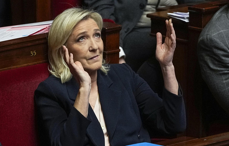 French far-right National Rally party leader Marine Le Pen reacts during the speech of French Prime Minister Gabriel Attal at the National Assembly, Tuesday, Jan. 30, 2024 in Paris. French Prime Minister Gabriel Attal said on Tuesday his top priority is to boost employment in his general policy address to lawmakers, three weeks after he was appointed. Attal is facing his first major challenge as angry farmers are protesting across the country and around Paris against low wages and other problems.(AP Photo/Michel Euler)