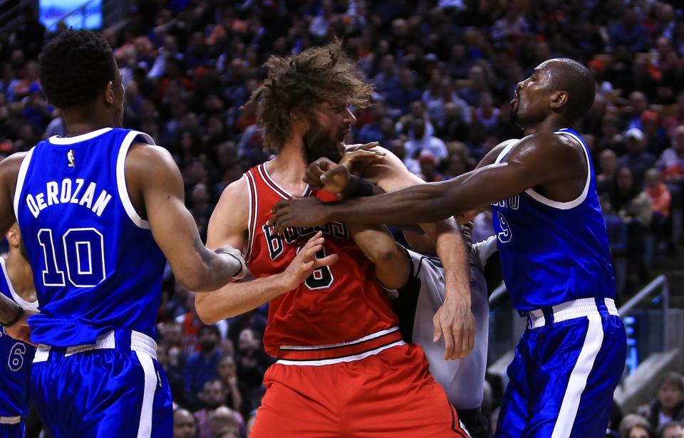 <p>Robin Lopez #8 of the Chicago Bulls fights with Serge Ibaka #9 of the Toronto Raptors during the second half of an NBA game at Air Canada Centre on March 21, 2017 in Toronto, Canada. NOTE TO USER: User expressly acknowledges and agrees that, by downloading and or using this photograph, User is consenting to the terms and conditions of the Getty Images License Agreement. (Photo by Vaughn Ridley/Getty Images) </p>