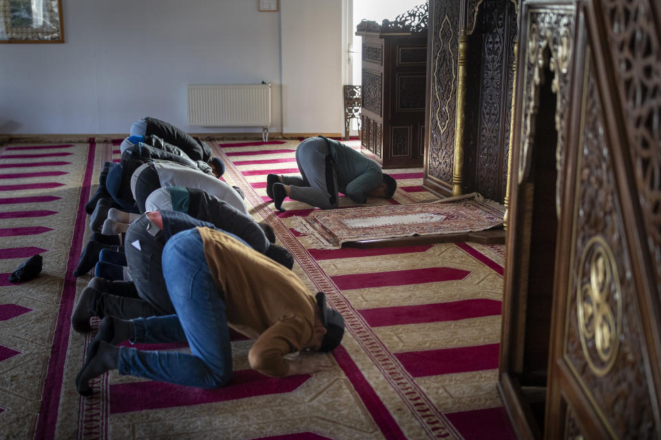 Muslims pray for the safety of the Palestinian people during a Friday prayer at Islamic Culture and Education Center in Vilnius, Lithuania, Friday, Oct. 13, 2023. In Muslim communities across the world, worshippers gathered at mosques for their first Friday prayers since Hamas militants attacked Israel, igniting the latest Israel-Palestinian war. (AP Photo/Mindaugas Kulbis)