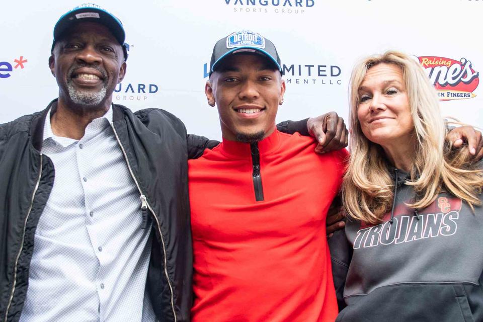 <p>Maximilian Haupt/picture alliance/Getty</p> Amon-Ra St. Brown and his parents John and Miriam Brown  after being selected in the NFL draft on May 1, 2021. 