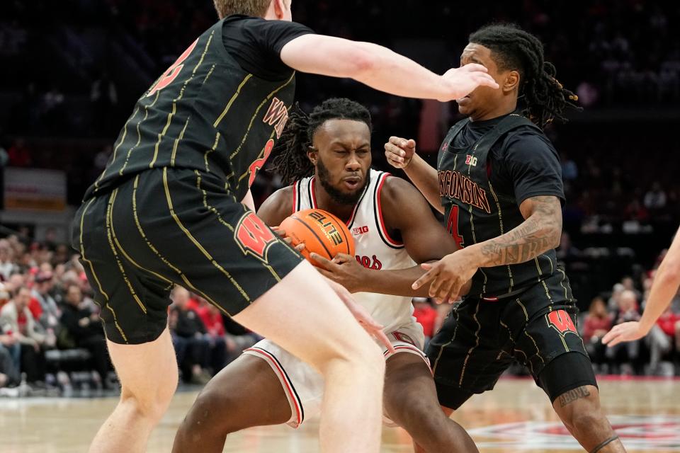 Feb 2, 2023; Columbus, OH, USA;  Ohio State Buckeyes guard Bruce Thornton (2) is guarded by Wisconsin Badgers forward Steven Crowl (22) and guard Kamari McGee (4) during the first half of the NCAA men’s basketball game at Value City Arena. Mandatory Credit: Adam Cairns-The Columbus Dispatch