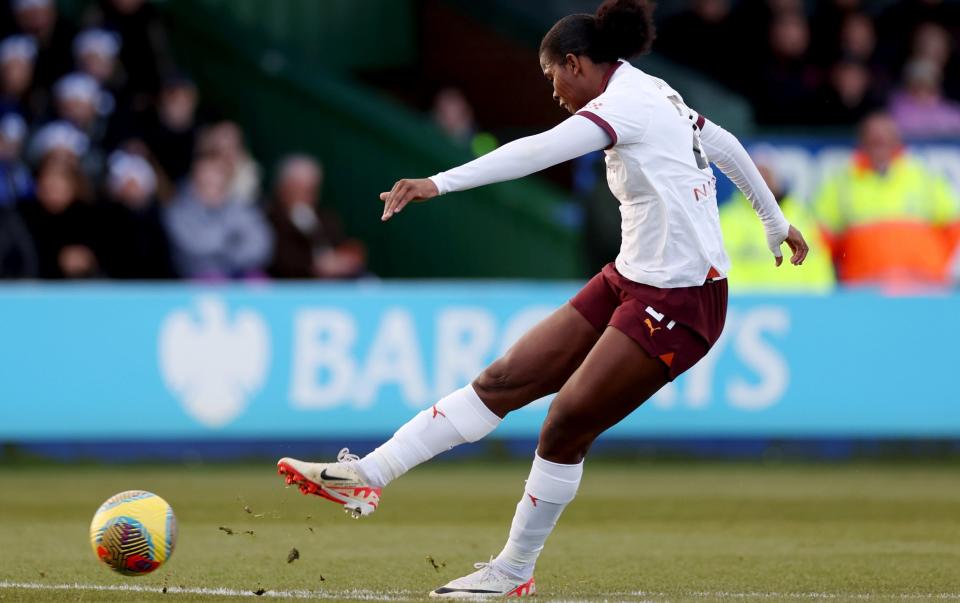 Manchester City's Khadija Shaw scores her team's second goal against Everton