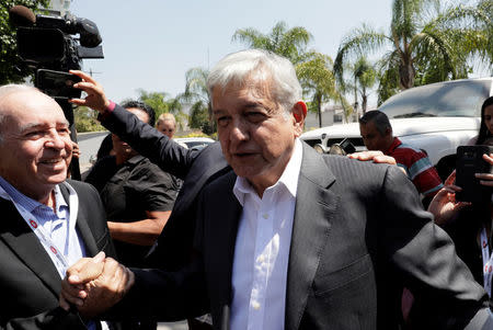 Leftist front-runner Andres Manuel Lopez Obrador of the National Regeneration Movement (MORENA) leaves at a hotel after attending a conference organised by the Mexican Construction Industry Association in Guadalajara, Mexico March 23, 2018. REUTERS/Henry Romero