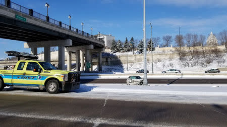 A smashed car is seen on a road in Saint Paul, U.S., January 28, 2019 in this picture obtained from social media. Mark J. Westpfahl/via REUTERS