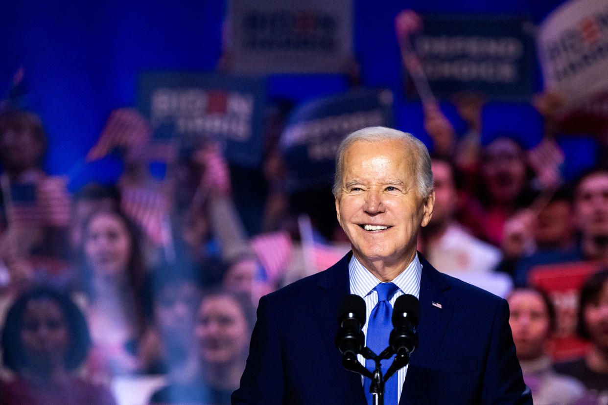 Joe Biden at the microphone while supporters cheer behind him. (Julia Nikhinson / Bloomberg via Getty Images file)