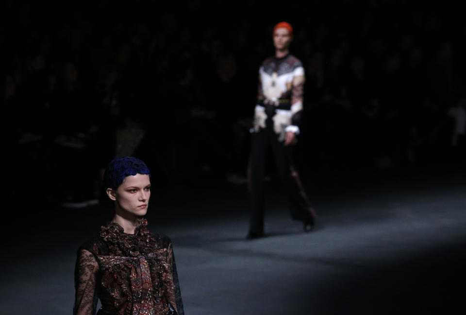 Models wear creations by designer Riccardo Tisci for Givenchy as part of his Fall/Winter 2013-2014 ready to wear collection, in Paris, Sunday, March, 3, 2013. (AP Photo/Christophe Ena)