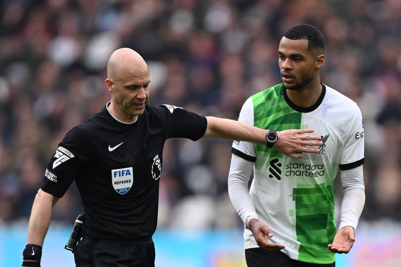 Referee Anthony Taylor speaks to Liverpool's Cody Gakpo at West Ham