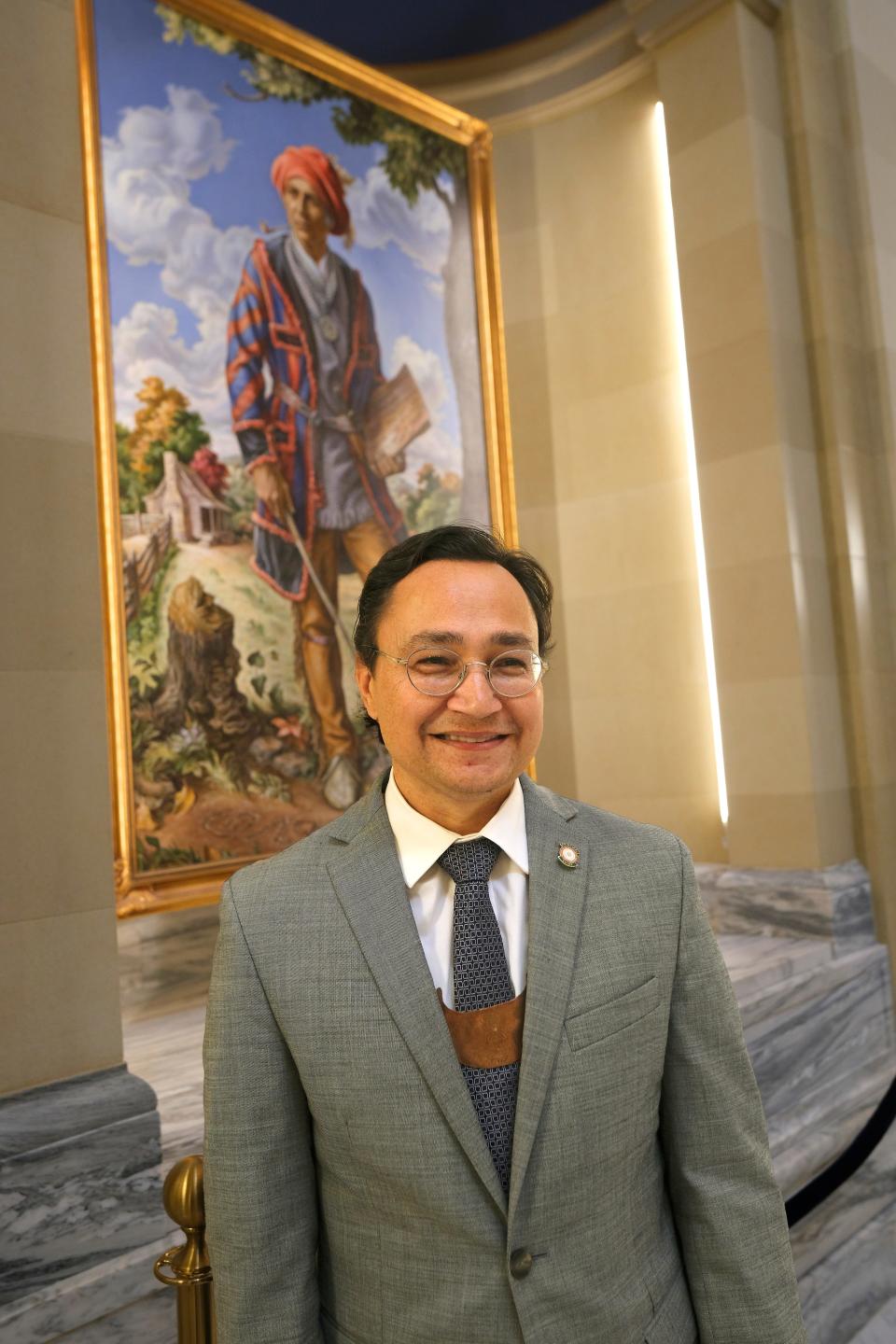 Cherokee Nation Principal Chief Chuck Hoskin Jr. poses for a photo in front of the portrait of Sequoyah at the Oklahoma Capitol, Tuesday, Nov. 7, 2023