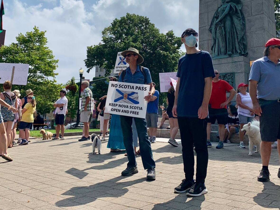 People are seen protesting Nova Scotia's vaccine passport system in August 2021. Premier Tim Houston says people have a right to protest, but that right shouldn't get in the way of health-care workers' ability to go to work or patients to receive services. (Aly Thomson/CBC - image credit)