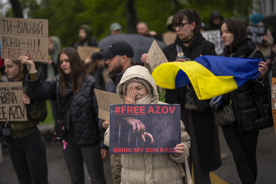 People attend a rally aiming to raise awareness on the fate of Ukrainian prisoners of war in Kyiv, Ukraine, Sunday, April 21, 2024. The U.S. House of Representatives swiftly approved $95 billion in foreign aid for Ukraine, Israel and other U.S. allies in a rare Saturday session as Democrats and Republicans banded together after months of hard-right resistance over renewed American support for repelling Russia's invasion. (AP Photo/Francisco Seco)