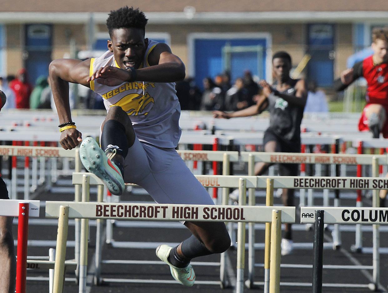 Beechcroft's Jayden Douglas runs in the 110 meter hurdles during the Cougar's Invitational at Beechcroft High School on April 27.