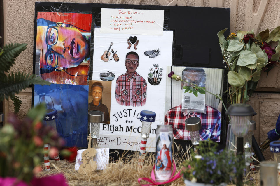 FILE - A makeshift memorial stands at a site across the street from where Elijah McClain was stopped by Aurora, Colo., Police Department officers while walking home, before family members hold a news conference, Friday, July 3, 2020, in Aurora, Colo. Four years after Elijah McClain died after being stopped by police in Colorado, two of the police officers charged in his death are set to go on trial. Prosecutors are expected to present opening statements Wednesday, Sept. 20, 2023, in the trial of Randy Roedema and Jason Rosenblatt on manslaughter, criminally negligent reckless homicide and assault charges. They, a third officer and two paramedics were indicted in 2021 by a state grand jury convened following an outcry over McClain’s death. (AP Photo/David Zalubowski, File)