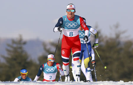 Marit Bjoergen of Norway in action in the women's 30km cross-country mass start classic. REUTERS/Carlos Barria