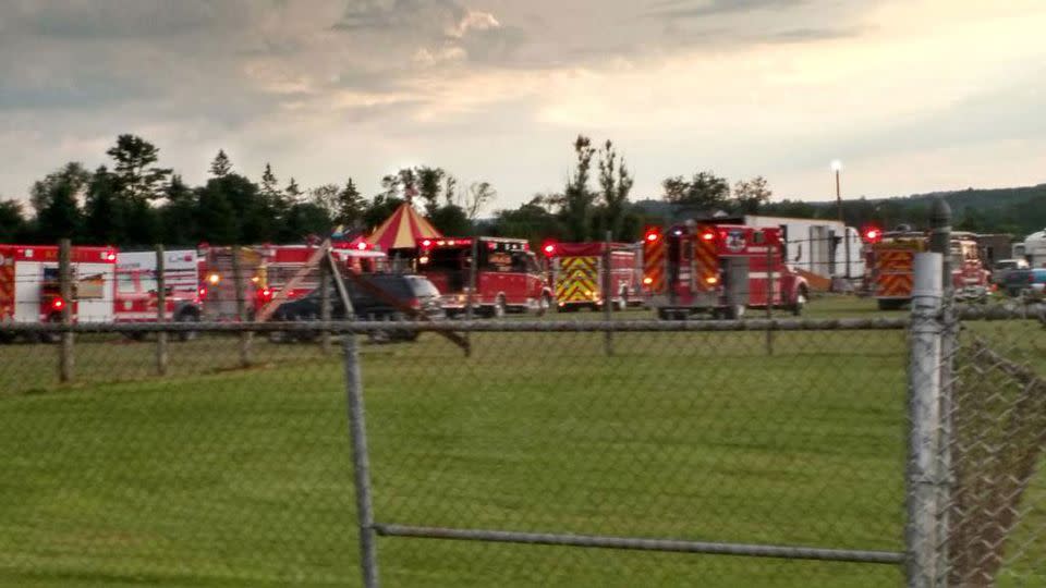 Officers surround the scene of a tent collapse New Hampshire fairground. Photo: Sebastian Fuentes via AP