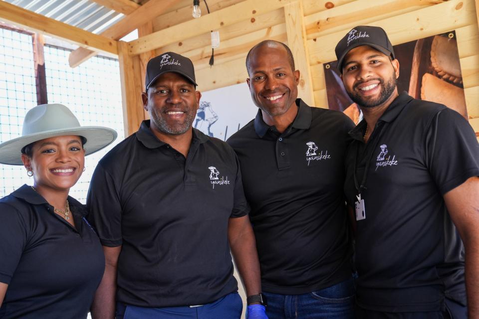 From left, Winivier, Huascar, Hatuey, and Oliver Mendoza pose for a portrait inside the Yanikeke empanadas booth during a game between the Arizona Diamondbacks and the Colorado Rockies at Salt River Fields on Sunday, March 12, 2023, in Scottsdale.