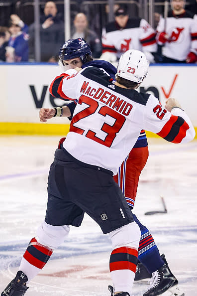 NEW YORK, NY – APRIL 03: New York Rangers Right Wing Matt Rempe (73) and New Jersey Devils Winger Kurtis MacDermid (23) fight before the opening face-off in the National Hockey League game between the New Jersey Devils and the New York Rangers on April 4, 2024 at Madison Square Garden in New York, NY. (Photo by Joshua Sarner/Icon Sportswire via Getty Images)