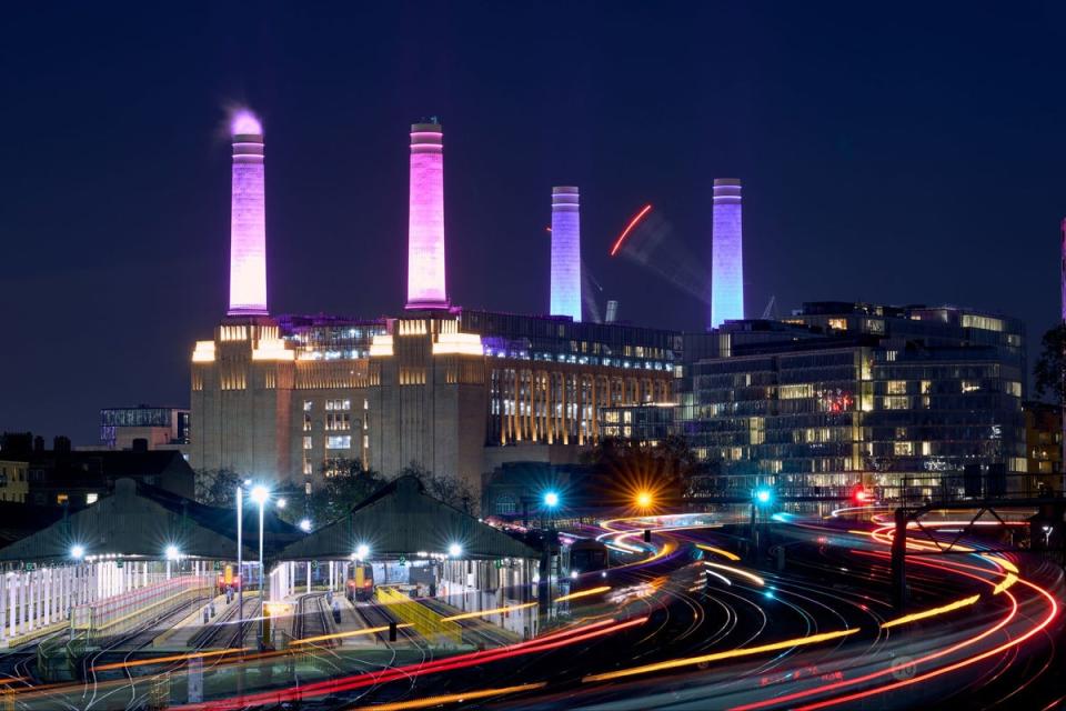 Battersea park power station in London lit up at night (PA)