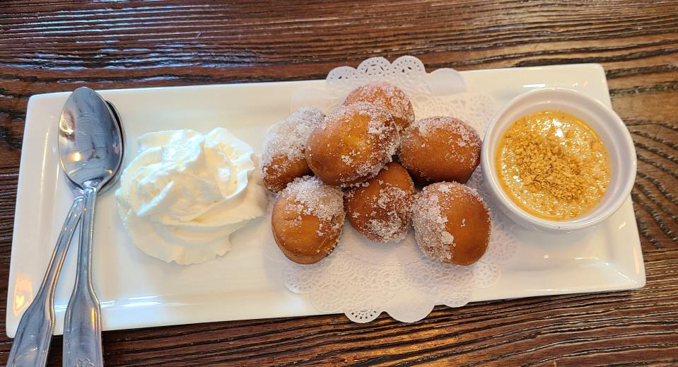 Kim-Chi Grill's donuts with whipped cream and sweet-cashew sauce, $7.